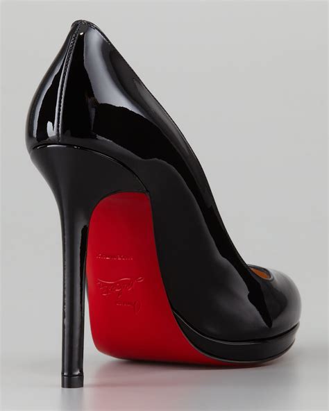 black high heels with red bottom.